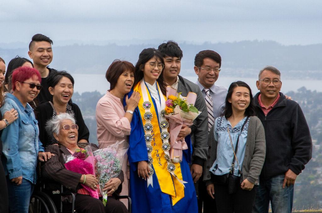 Family getting the photo taken at commencement.